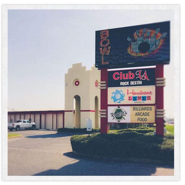 A retro-style building with a marquee sign that reads